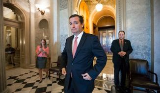 Sen. Ted Cruz, R-Texas, leaves the floor of the Senate after skirmishing with Senate Majority Leader Harry Reid, D-Nev., over the Affordable Care Act, popularly know as &quot;Obamacare,&quot; at the Capitol in Washington, Monday, Sept. 23, 2013. (AP Photo/J. Scott Applewhite)