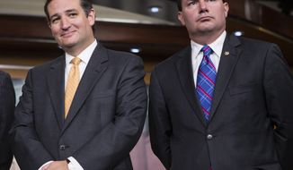 **FILE** Republican Sens. Ted Cruz (left) of Texas and Mike Lee of Utah stand during a news conference with conservative congressional Republicans at the Capitol in Washington on Sept. 19, 2013. (Associated Press)