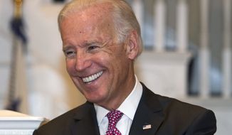 ** FILE ** Vice President Joseph R. Biden smiles while hosting a reception at the Naval Observatory in Washington, Sept. 12, 2013. (AP Photo/Cliff Owen, File)