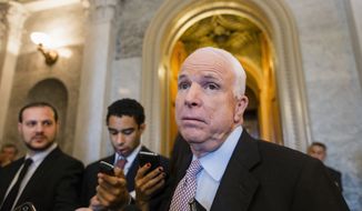 ** FILE ** Sen. John McCain, R-Ariz., speaks with reporters at the Capitol in Washington, Friday, Sept. 27, 2013. (AP Photo/J. Scott Applewhite)