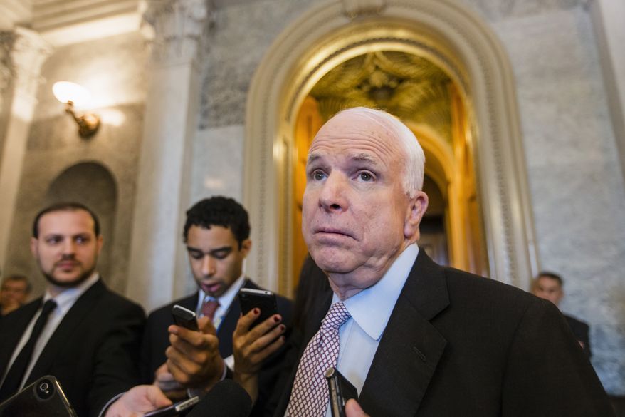 ** FILE ** Sen. John McCain, R-Ariz., speaks with reporters at the Capitol in Washington, Friday, Sept. 27, 2013. (AP Photo/J. Scott Applewhite)