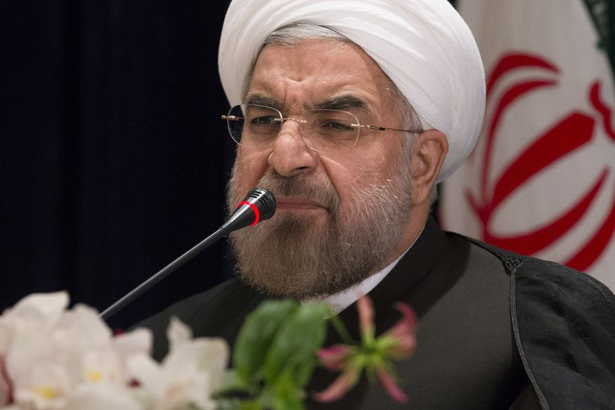 ** FILE ** Iranian President Hassan Rouhani responds to a question during a news conference at the Millennium Hotel in midtown Manhattan, Friday, Sept. 27, 2013, in New York. (AP Photo/John Minchillo)