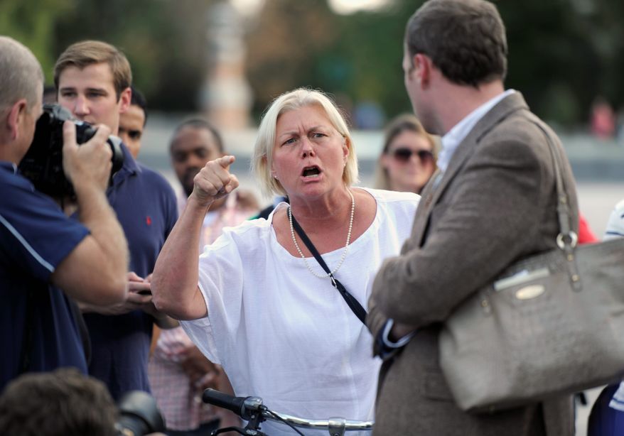 Cathryn Carroll, who lives in the District, expresses her displeasure of House Republicans as they rallied outside the Capitol and accused Senate Democrats of stalling.