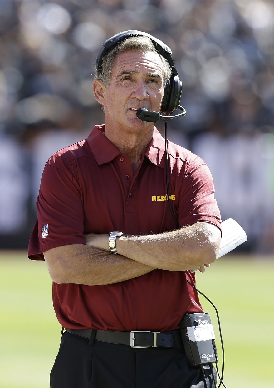 Washington Redskins head coach Mike Shanahan walks on the sideline during the first quarter of an NFL football game against the Oakland Raiders in Oakland, Calif., Sunday, Sept. 29, 2013. (AP Photo/Ben Margot)