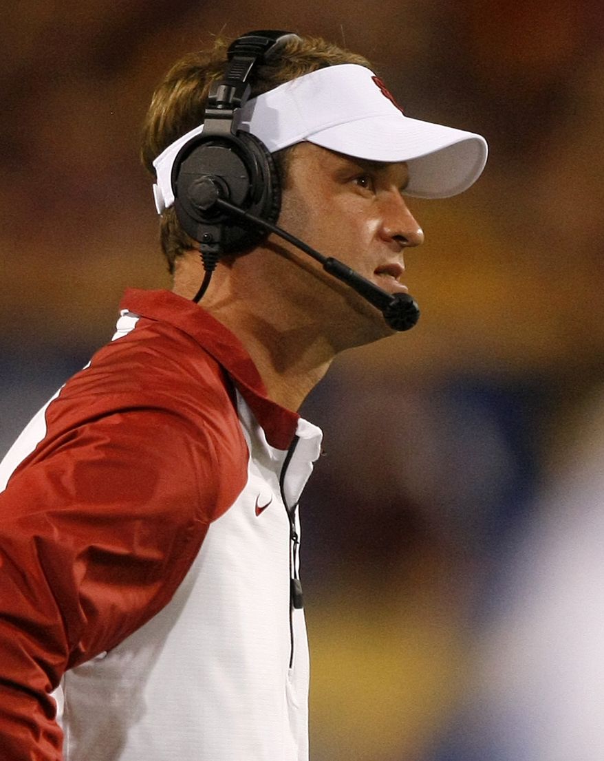 FILE - Southern California head coach Lane Kiffin reacts after losing to Arizona State 62-41 during an NCAA college football game In a Saturday, Sept. 28 2013 file photo, in Tempe, Ariz. USC has fired football coach Lane Kiffin, the Trojans announced early Sunday, Sept. 29, 2013. Kiffin went 28-15 at USC in parts of four seasons, but his club has dropped seven of its last 11 games overall and is winless in a pair of Pac-12 games so far this year. (AP Photo/Rick Scuteri)