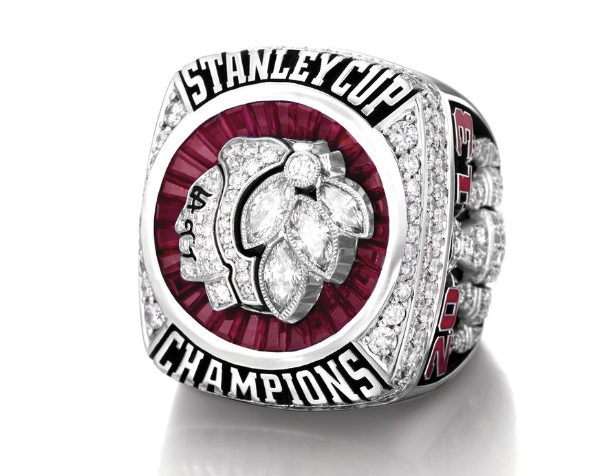This undated photo provided by the Chicago Blackhawks shows the ring presented to the 2013 Stanley Cup-winning Blackhawks players during a private ceremony Sunday, Sept. 29, 2013, in Chicago. The team and Minneapolis-based jeweler Jostens collaborated on the design of the ring that features the Blackhawks logo with diamonds, emeralds and rubies. The Blackhawks won the NHL championship in June with victories over the Boston Bruins. (AP Photo/Courtesy of the Chicago Blackhawks)