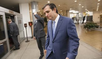 Sen. Ted Cruz, R-Texas, returns to his Capitol Hill office after the Senate once again rejected the House version of the government funding bill, Monday night, Sept. 30, 2013, in Washington. The Republican-controlled House and the Democrat-controlled Senate are at an impasse as Congress continues to struggle over how to prevent a possible shutdown of the federal government when it runs out of money. President Barack Obama ramped up pressure on Republicans Monday to avoid a post-midnight government shutdown, saying that failure to pass a short-term spending measure to keep agencies operating would &quot;throw a wrench into the gears&quot; of a recovering economy. (AP Photo/J. Scott Applewhite)