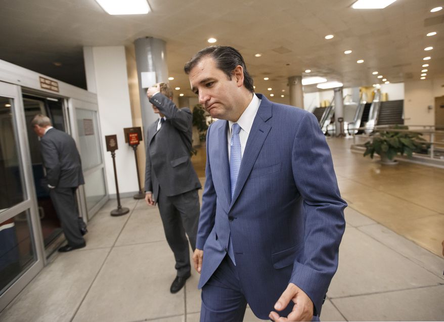 Sen. Ted Cruz, R-Texas, returns to his Capitol Hill office after the Senate once again rejected the House version of the government funding bill, Monday night, Sept. 30, 2013, in Washington. The Republican-controlled House and the Democrat-controlled Senate are at an impasse as Congress continues to struggle over how to prevent a possible shutdown of the federal government when it runs out of money. President Barack Obama ramped up pressure on Republicans Monday to avoid a post-midnight government shutdown, saying that failure to pass a short-term spending measure to keep agencies operating would "throw a wrench into the gears" of a recovering economy. (AP Photo/J. Scott Applewhite)
