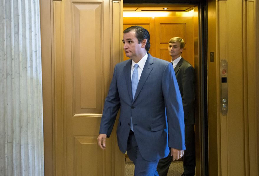 Sen. Ted Cruz, R-Texas, arrives at the Senate floor for a vote on the government funding bill, at the Capitol in Washington, Monday, Sept. 30, 2013. (AP Photo/J. Scott Applewhite)