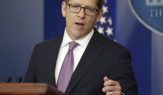 White House press secretary Jay Carney gestures while speaking during his daily news briefing at the White House in Washington on Monday, Sept. 30, 2013. (AP Photo/Pablo Martinez Monsivais)