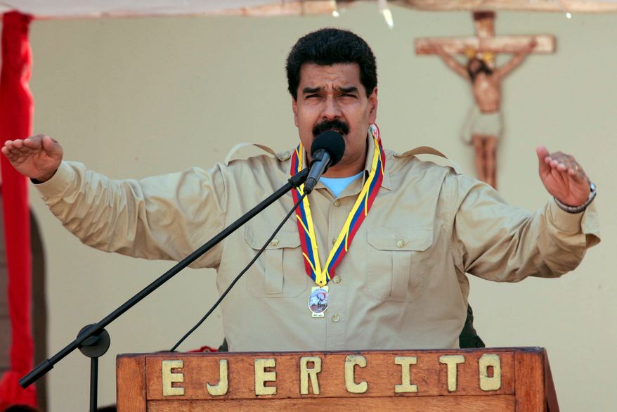 ** FILE ** In this photo released by Miraflores Press Office, Venezuela's Nicolas Maduro speaks to soldiers inside a military base in Coro, Venezuela, Monday, Sept. 30, 2013. Maduro said Monday that his government was expelling the top U.S. diplomat in Venezuela and two other embassy employees for allegedly conspiring with the political opposition. (AP Photo/Miraflores Press Office)