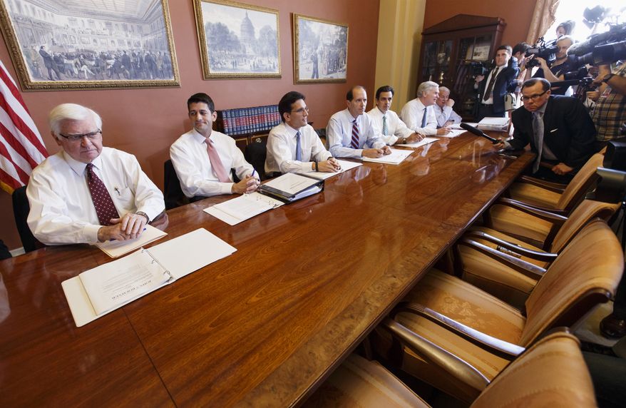House Majority Leader Eric Cantor (third from left), Virginia Republican, meets with House GOP conferees as the Republican-controlled House and the Democrat-controlled Senate remain at an impasse over funding the federal government, with neither side backing down over Obamacare, on Tuesday, Oct. 1, 2013, on Capitol Hill in Washington. Mr. Cantor indicated that the chairs opposite him were intended for Democrats to join in the discussions, but he said they declined. From left are Republican Reps. Hal Rogers of Kentucky, Appropriations Committee chairman; Paul Ryan of Wisconsin, Budget Committee chairman; Mr. Cantor; Dave Camp of Michigan, Ways and Means Committee chairman; Tom Graves of Georgia; and other House members. (AP Photo/J. Scott Applewhite)