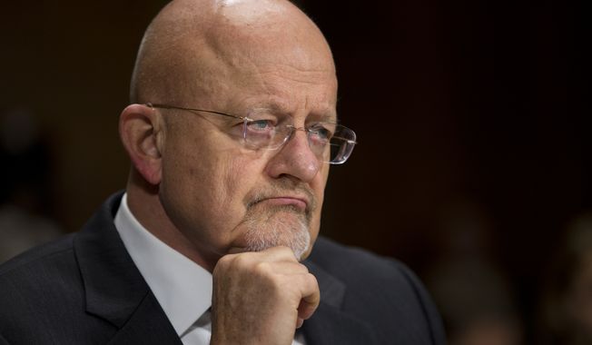 National Intelligence Director James Clapper pauses during a Senate Judiciary Committee oversight hearing on the Foreign Intelligence Surveillance Act on Capitol Hill on Wednesday, Oct. 2, 2013 in Washington. U.S. intelligence officials say the government shutdown is seriously damaging the intelligence community&amp;#8217;s ability to guard against threats. (AP Photo/ Evan Vucci) 