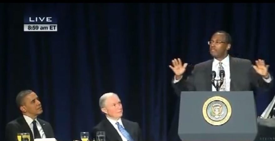 Ben Carson, right, speaking at the 2013 National Prayer Breakfast in Washington, where he burst on the national scene when he criticized Obamacare with President Obama himself seated nearby on the dais. (Courtesy of C-SPAN)