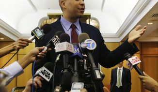 ** FILE ** In a Thursday, Sept. 26, 2013, file photo, Newark Mayor and senate candidate Cory Booker answers a question in Newark, N.J. (AP Photo/Mel Evans, File)