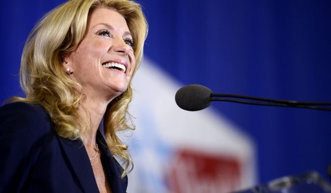 State Sen. Wendy Davis, D-Fort Worth, speaks at a rally Thursday, Oct. 3, 2013, in Haltom City, Texas, where she formally declared her candidacy for governor of Texas. (AP Photo/The Daily Texan, Charlie Pearce)
