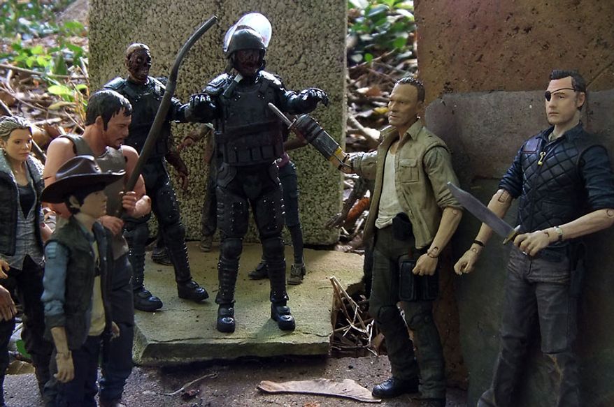 The Governor and Merle are threatened by Andrea, Carl and Daryl as Riot Gear Zombie and Riot Gear Gas Mask Zombie attack in McFarlane Toys' The Walking Dead TV Series action figure collection. (Photo by Joseph Szadkowski/The Washington Times)