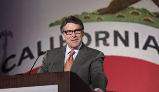 ** FILE ** Texas Gov. Rick Perry gives the keynote speech at the California Republican Party convention in Anaheim, Calif., Saturday, Oct. 5, 2013.  (AP Photo/Reed Saxon)