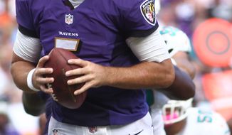 Baltimore Ravens quarterback Joe Flacco (5) looks to pass during the second half of an NFL football game against the Miami Dolphins, Sunday, Oct. 6, 2013, in Miami Gardens, Fla. (AP Photo/J Pat Carter)