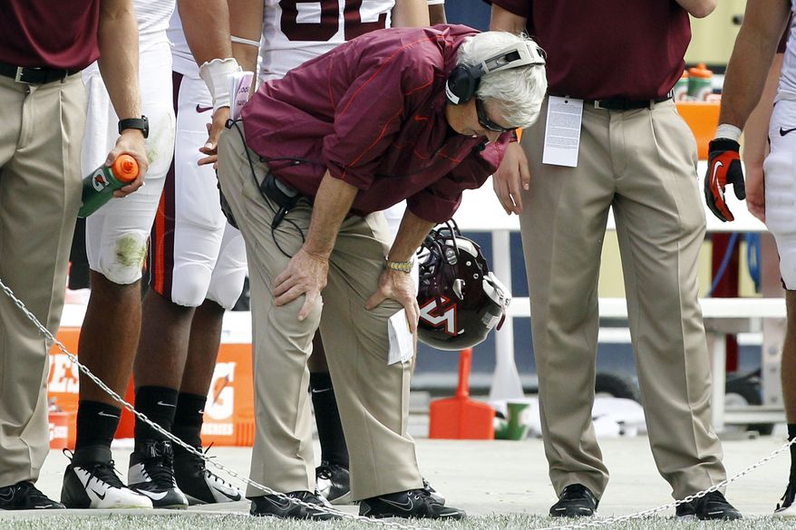 Virginia Tech head coach Frank Beamer puts his hands on his knees as he stands along the sideline after his team failed to convert a fourth down in the fourth quarter of their NCAA college football game against Pittsburgh, Saturday, Sept. 15, 2012, in Pittsburgh. Pittsburgh won 35-17. (AP Photo/Keith Srakocic)