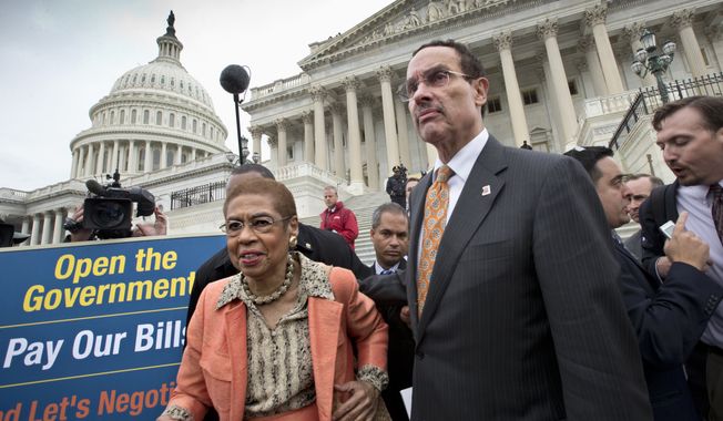 Washington Mayor Vincent Gray, right, and Del. Eleanor Holmes Norton, D-D.C., left, make their way through the crowd after joining Senate Democrats outside the Capitol in Washington, Wednesday, Oct. 9, 2013, to urge House Speaker John Boehner of Ohio, and other House Republicans, to break the impasse on a funding bill and stop the government shutdown that is now in its second week. Gray said in a statement Tuesday that the shutdown, now in its second week, is having dire consequences in his city. He said D.C. is the only city in the country where residents are worried that their local government won&#x27;t be able to provide basic services during the shutdown.  (AP Photo/J. Scott Applewhite)