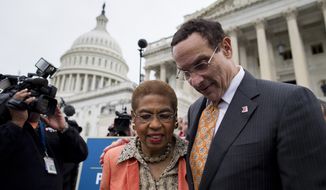 Washington, Mayor Vincent Gray, right, Del. Eleanor Holmes Norton, D-D.C., left, make their way through the crowd after joining Senate Democrats outside the Capitol in Washington, Wednesday, Oct. 9, 2013, to urge House Speaker John Boehner of Ohio, and other House Republicans, to break the impasse on a funding bill and stop the government shutdown that is now in its second week. Gray said in a statement Tuesday that the shutdown, now in its second week, is having dire consequences in his city. He said D.C. is the only city in the country where residents are worried that their local government won&#39;t be able to provide basic services during the shutdown. (AP Photo/ Evan Vucci)