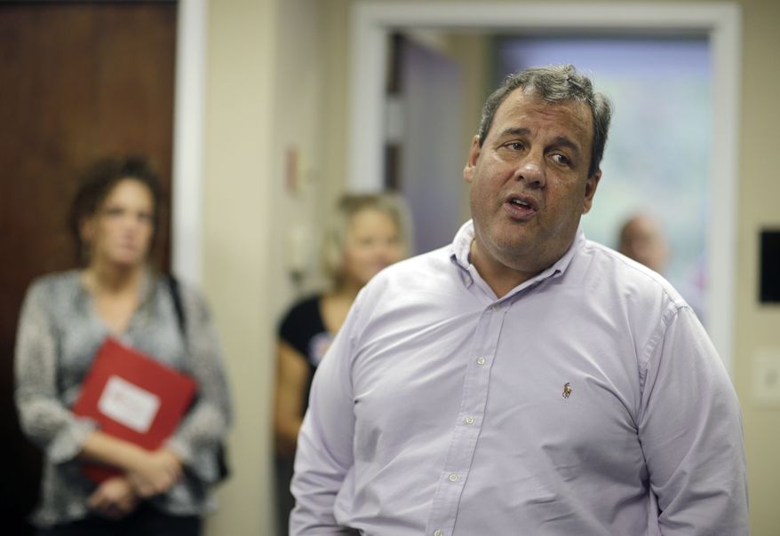 New Jersey Gov. Chris Christie addresses some campaign workers in East Brunswick, N.J., Tuesday, Oct. 8, 2013. Asked Tuesday why voters should give him another term, Christie said he's been honest about the state's problems and worked with Democrats to find bipartisan solutions. (AP Photo/Mel Evans)