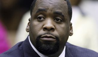 ** FILE ** In this May 25, 2010, file photo, former Detroit Mayor Kwame Kilpatrick sits at his sentencing in Wayne County Circuit Court on an obstruction-of-justice conviction. (AP Photo/Paul Sancya, File)