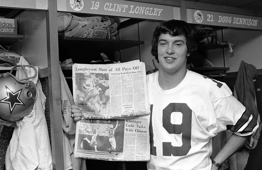 Clint Longley, Dallas Cowboys rookie quarterback, holds two of the local newspapers proclaiming his outstanding play in the Cowboys 24-23 victory over the Washington Redskins on Thursday, shown in Dallas, Texas on Nov. 29, 1974. Longley came in the third quarter after Roger Staubach was injured and guided the team from a 16-3 deficit to a last second victory with a 50-yard touchdown pass. (AP Photo/Harold Waters)
