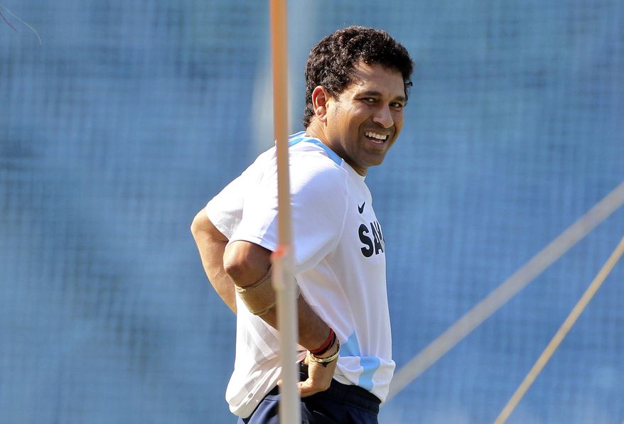 FILE - In this Nov. 20, 2011 file photograph, India's Sachin Tendulkar smiles during a training session ahead of their third test cricket match against West Indies in Mumbai, India. Tendulkar said Thursday, Oct. 10, 2013, he will retire from international cricket after playing his 200th test match next month. (AP Photo/Rajanish Kakade, File)