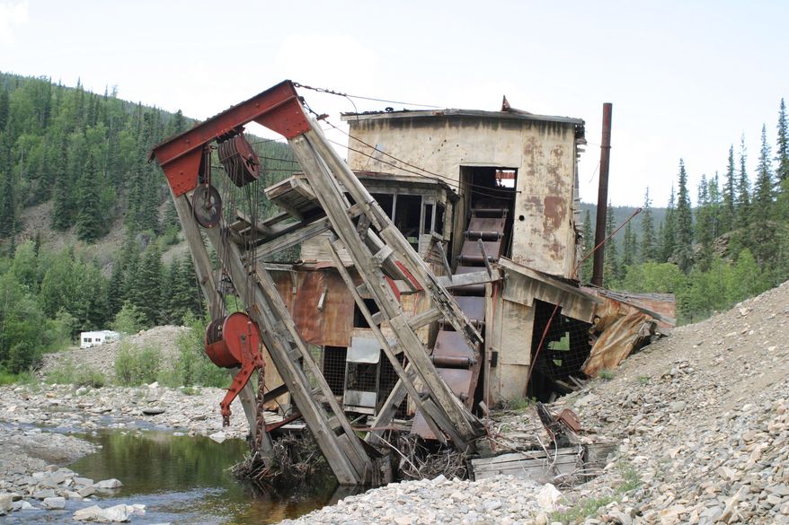 **FILE** The Jack Wade gold dredge sits on Wade Creek along the Taylor Highway north of Chicken, Ala., on June 30, 2005. The dredge, once used for gold mining and later a popular tourist stop along the highway, was demolished in September 2007 by the Bureau of Land Management because of safety concerns. (Associated Press)