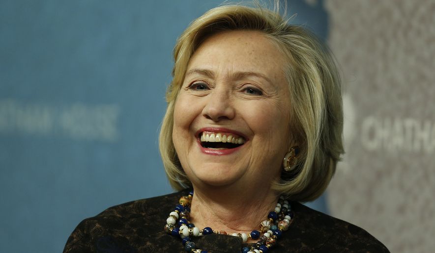 Former U.S. Secretary of State Hillary Clinton laughs as she arrives for an event at Chatham House in London, Friday, Oct. 11, 2013. (Associated Press) ** FILE **