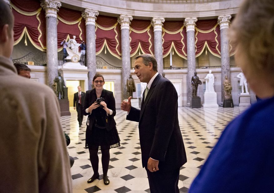 House Speaker John Boehner of Ohio stops to greet visitors from Panama City, Fla., guests of Rep. Steve Southerland, R-Fla., in Statuary Hall on Capitol Hill in Washington, Friday, Oct. 11, 2013. After weeks of ultimatums, President Barack Obama and congressional Republicans are exploring whether they can end a budget standoff that has triggered a partial government shutdown and edged Washington to the verge of a historic, economy-jarring federal default. (AP Photo/J. Scott Applewhite)