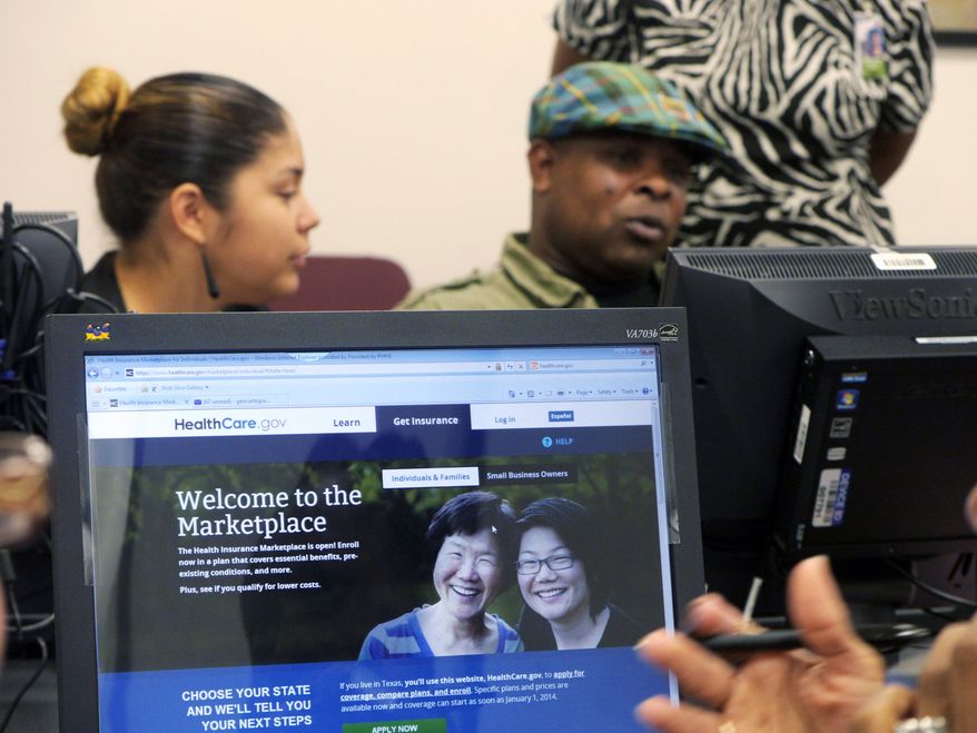 Parkland Memorial Hospital financial counselor Tiffany Ruiz, left, helps Vyncent Bosh sign up for insurance under the Affordable Care Act on Friday, Oct. 11, 2013, in Dallas. (AP Photo/The Dallas Morning News, Ron Baselice)