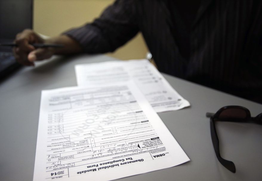 **FILE** Louis Peters fills out papers on Oct. 1, 2013, at the Henry J. Austin Health Center in Trenton, N.J., to sign up for new plans through a health insurance exchange. Despite anecdotal evidence of high interest and the political stakes attached to Obama's Affordable Care Act, a nation obsessed with keeping score of winners and losers lacks the data to pass early judgment on the success of a law that will in large part define the president's legacy. (Associated Press)