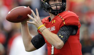 Maryland quarterback Caleb Rowe prepares to pass in the first half of an NCAA college football game against Virginia in College Park, Md., Saturday, Oct. 12, 2013. (AP Photo/Patrick Semansky)