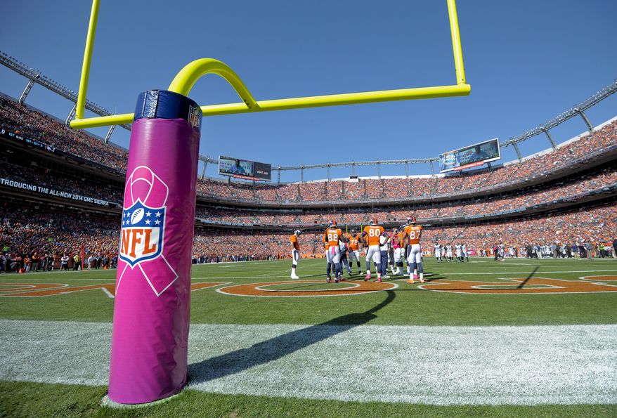 The south goal post at Sports Authority Field at Mile High Stadium is wrapped with a cover commemorating Breast Cancer Awareness Month in the first quarter of an NFL football game between the Denver Broncos and Jacksonville Jaguars, Sunday, Oct. 13, 2013, in Denver. (AP Photo/Jack Dempsey)