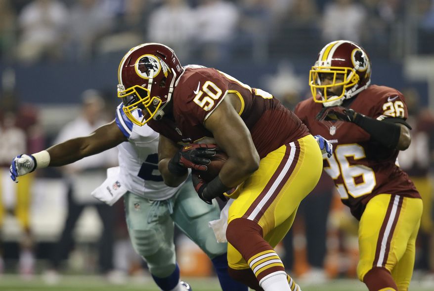 Washington Redskins outside linebacker Rob Jackson (50) comes up with an interception thrown by Dallas Cowboys quarterback Tony Romo in the first half of an NFL football game on Sunday, Oct. 13, 2013, in Arlington, Texas. (AP Photo/Tim Sharp)