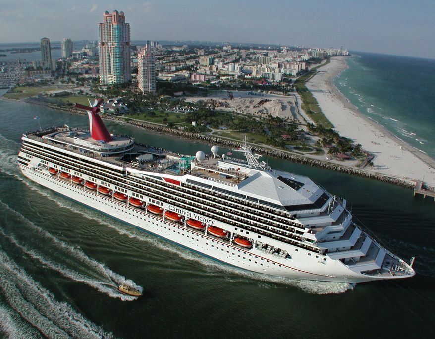 ** FILE ** In a Sunday, Oct. 15, 2000, file photo provided by Carnival Cruise Lines, Carnival Cruise Lines newest ship, the Carnival Victory, passes by Miami Beach as it embarks on its inaugural Caribbean voyage. A 6-year-old boy drowned in one of the pools aboard a Carnival Cruise Lines ship while at sea, the company said in a statement Monday, Oct. 14, 2013. (AP Photo/Carnival Cruise Lines, Andy Newman, File)