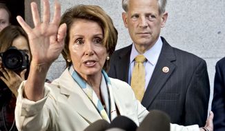 House Minority Leader Nancy Pelosi and Rep. Steve Israel, chairman of the Democratic Congressional Campaign Committee, are among top Democrats impugning Republicans as racist. (AP Photo/J. Scott Applewhite)