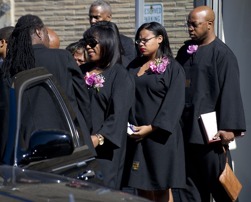 Valarie Carey, sister of Miriam Carey, exits Grace Funeral Chapels after the funeral for Miriam Carey in the Brooklyn borough of New York, on Tuesday, Oct. 15, 2013. Carey was shot to death by police after trying to ram her vehicle through a White House barrier. The dental hygienist from Stamford, Conn., is survived by her 1-year-old daughter, who was in the vehicle during the Oct. 3 car chase through the streets of Washington. Carey had been diagnosed with postpartum depression and psychosis. Authorities say she believed President Barack Obama was monitoring her electronically. (AP Photo/The Stamford Advocate, Lindsay Perry) MANDATORY CREDIT