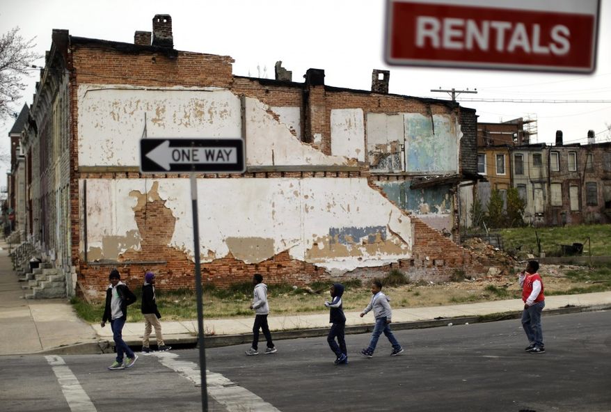 "Largely as a result of family breakdown, about 20-25 percent of American children live in poverty," writes Logan Delany, Jr. (Associated Press)