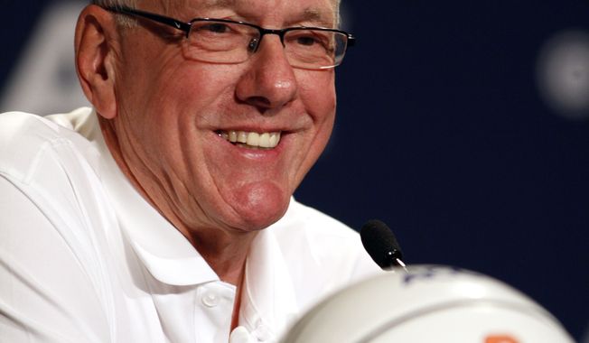 Syracuse coach Jim Boeheim smiles during a press conference at the Atlantic Coast Conference NCAA college basketball media day in Charlotte, N.C., Wednesday, Oct. 16, 2013. (AP Photo/Nell Redmond)
