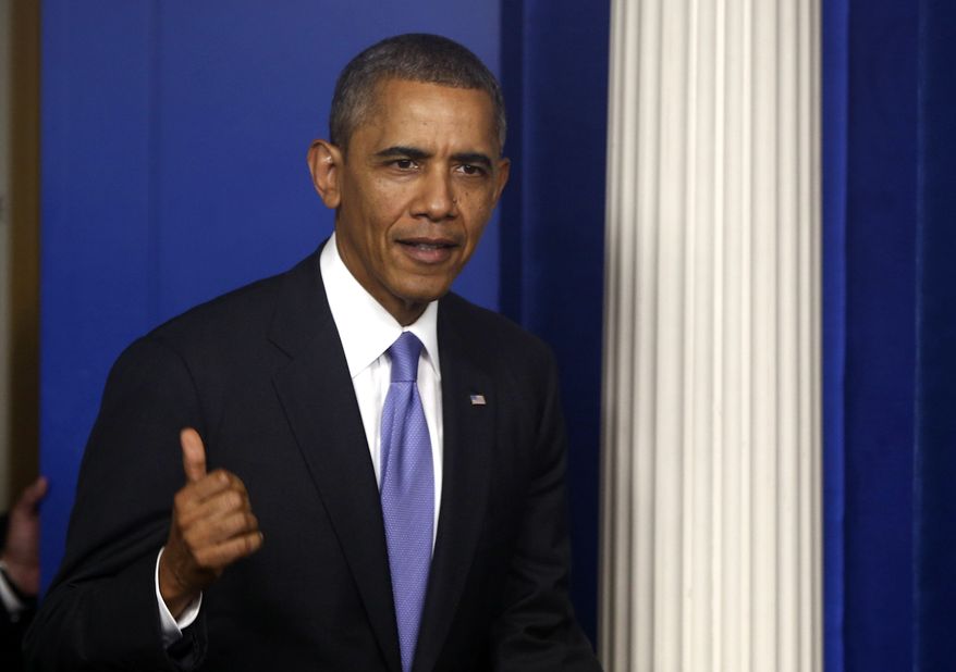 President Barack Obama walks out to make a statement to reporters in the Brady Press Briefing Room at the White House in Washington, Wednesday, Oct. 16, 2013. The Senate voted to avoid a financial default and reopen the government after a 16-day partial shutdown and the measure now heads to the House, which is expected to back the bill before day's end. (AP Photo/Charles Dharapak)