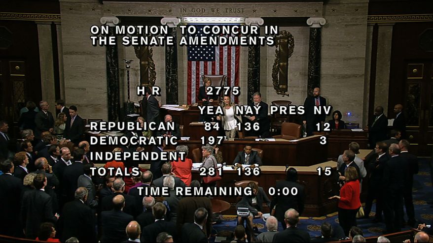 In this image from House Television, with partial voting totals on the screen, a woman, at the rostrum just below the House presiding officer, seen between the "yea" and "nay" wording, is removed from the House chamber after she began shouting during the vote for the bill to end the partial 16-day government shutdown and to fund the government. The woman was described by lawmakers and aides as a long-time House stenographer. (AP Photo/House TV)