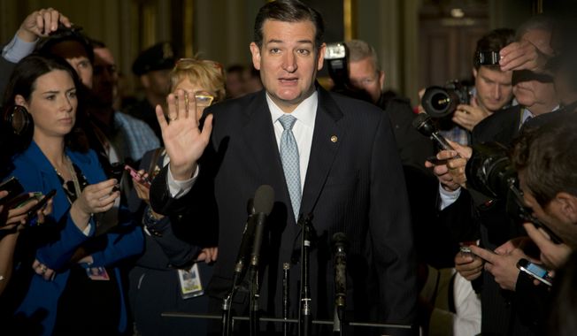 Sen. Ted Cruz, R-Texas, gestures as he talks with reporters on Capitol Hill, Wednesday, Oct. 16, 2013, in Washington. Sen. McConnell and his Democratic counterpart, Senate Majority Leader Harry Reid, D-Nev., are optimistic about forging an eleventh-hour bipartisan deal preventing a possible federal default and ending the partial government shutdown after Republican divisions forced GOP leaders to drop efforts to ram their own version through the House. (AP Photo/Carolyn Kaster) 