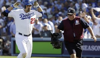 Los Angeles Dodgers&#39; Adrian Gonzalez celebrates after hitting a home run during the third inning of Game 5 of the National League baseball championship series against the St. Louis Cardinals Wednesday, Oct. 16, 2013, in Los Angeles. (AP Photo/David J. Phillip) 
