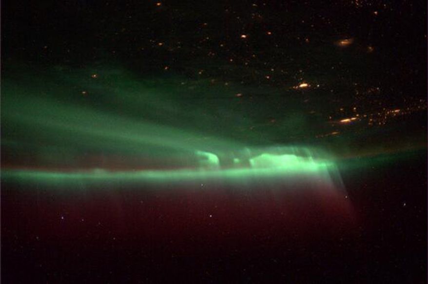 Mike Hopkins managed to capture a blast of green northern lights from a unique perspective about a week ago. (Credit Twitter: Mike Hopkins @AstroIllini)