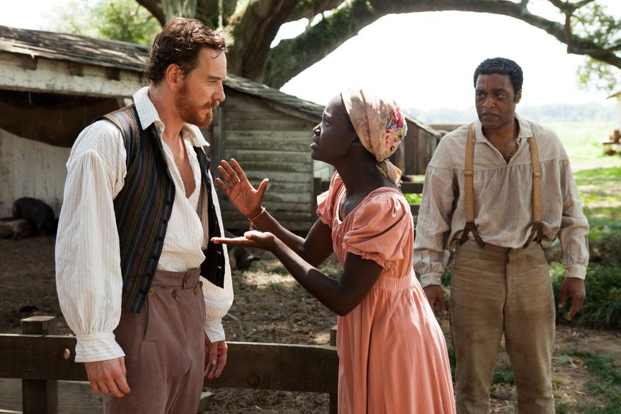 Michael Fassbender, left, Lupita Nyong'o, and Chiwetel Ejofor, right, in a scene from "12 Years A Slave." (AP Photo/Fox Searchlight, Francois Duhamel)