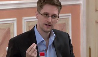 ** FILE ** Former National Security Agency contractor Edward Snowden speaks during a presentation ceremony for the Sam Adams Award in Moscow in this image made from video and released by WikiLeaks on Friday, Oct. 11, 2013. (AP Photo)
